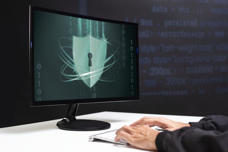 Cybersecurity professional monitoring digital shield protection with keyhole and binary data streams on secure network interface