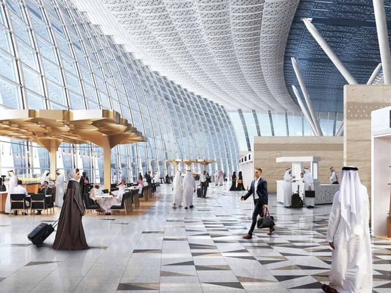 Modern airport terminal with architectural glass ceiling, digital infrastructure, and business travelers—enterprise security and connectivity solutions