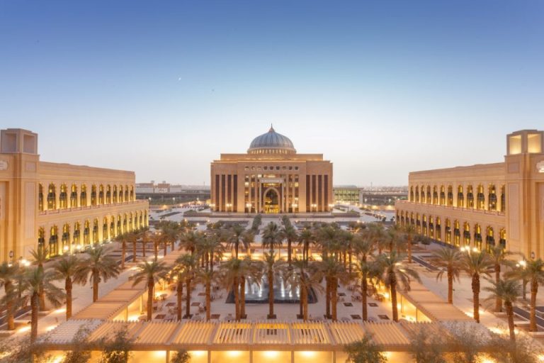 Baghdad's Parliament complex at dusk with illuminated neoclassical architecture symbolizing government data security and regulatory compliance infrastructure