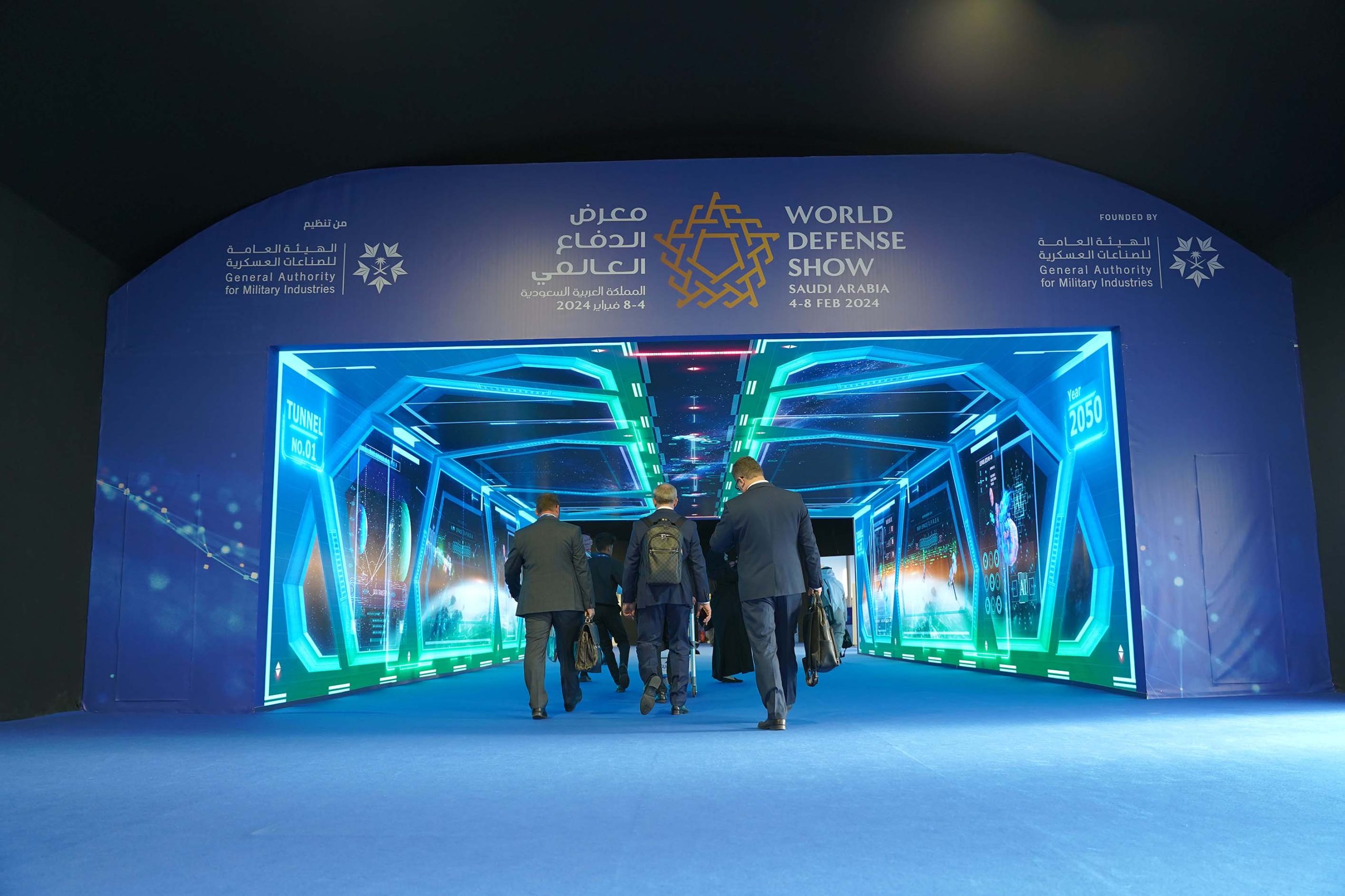 Cyber intelligence exhibition booth with neon blue-green lighting at World Defense Show Saudi Arabia 2024
