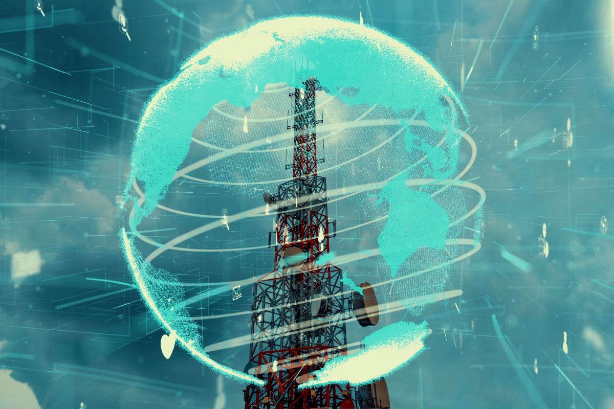 Telecommunications tower with 5G antennas surrounded by digital globe hologram representing global network connectivity